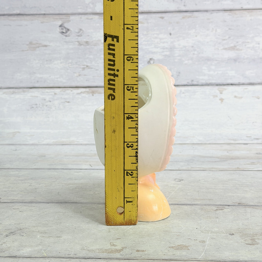 LH30 — Child vase beside ruler