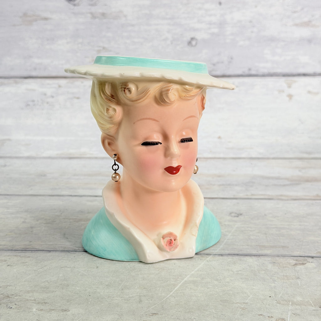 LH31 — Front showing Ucagco white hat and aqua neckline