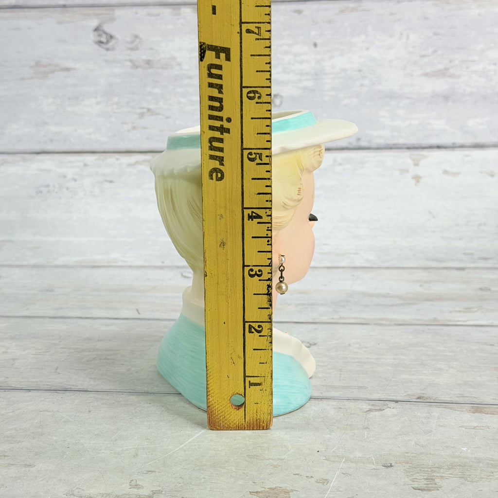 LH31 — Ucagco vase beside ruler