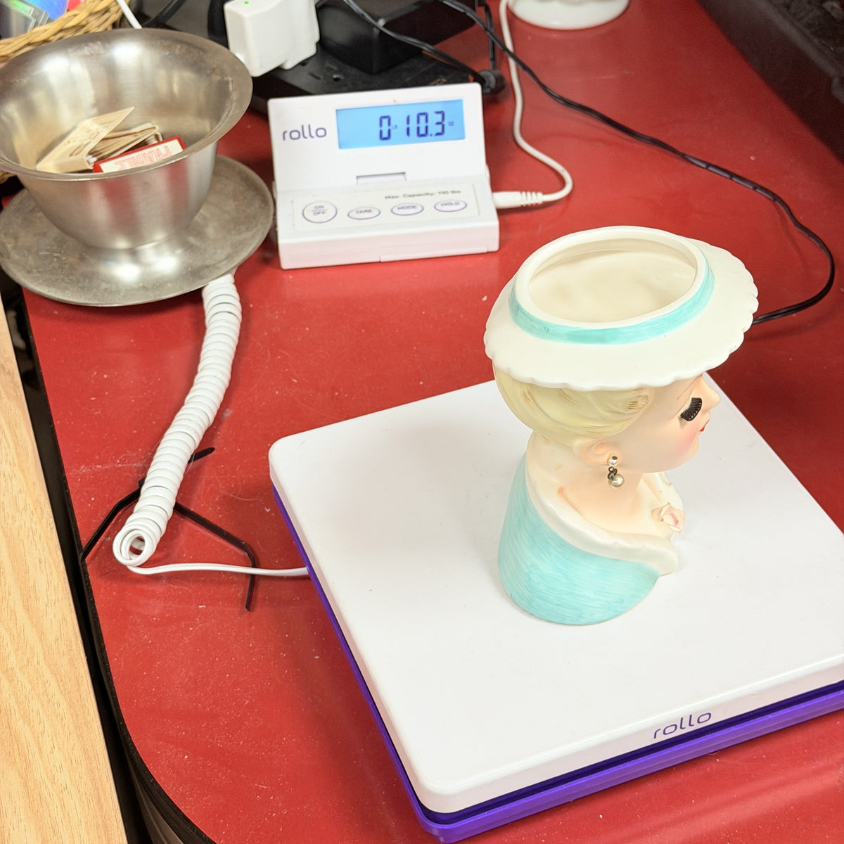 LH31 — Ucagco vase on scale