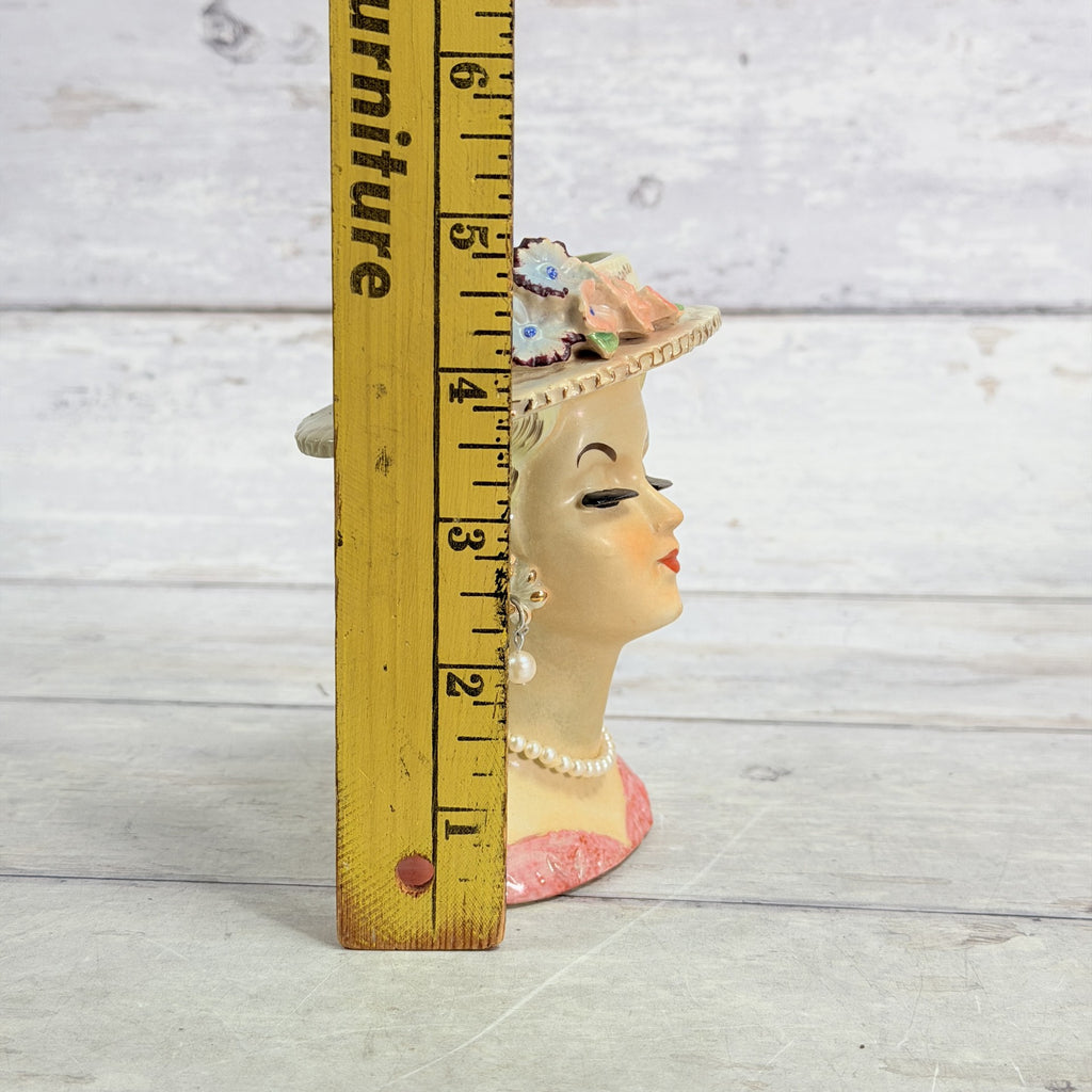 LH32 — Flower hat vase beside ruler