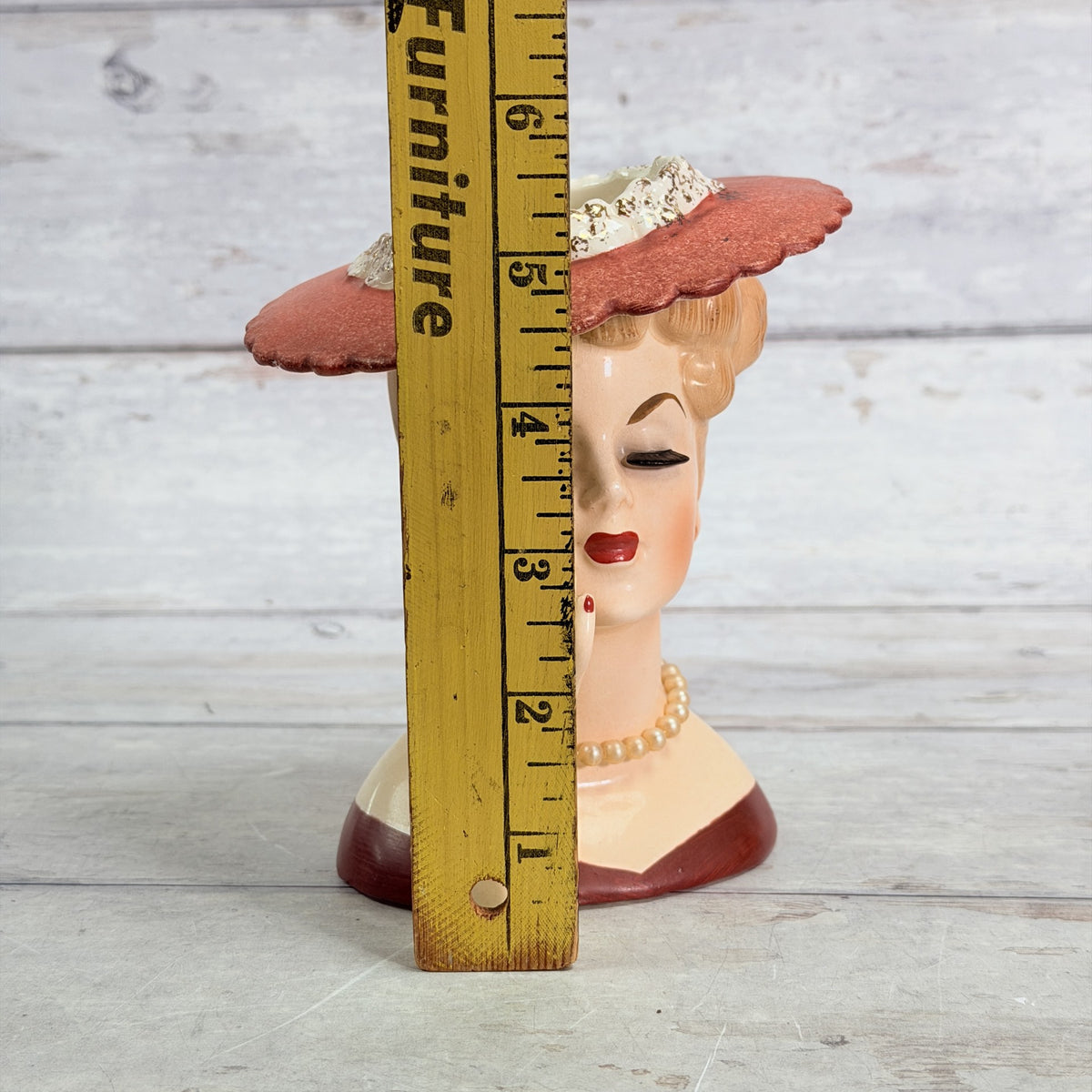 LH33 — Coral hat vase beside ruler