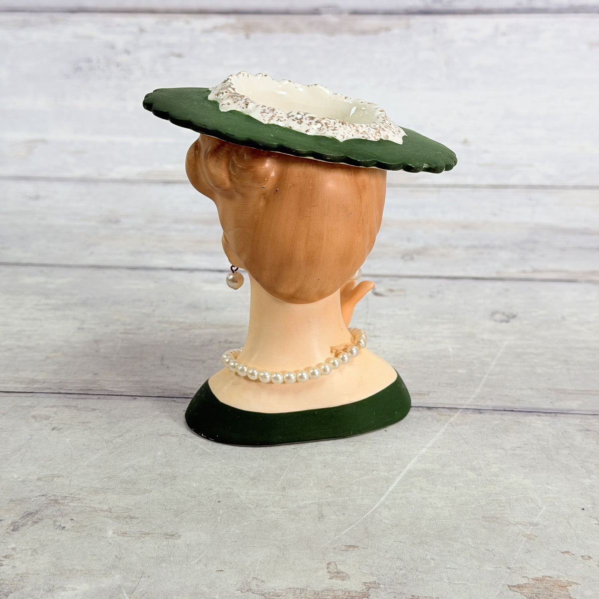 LH35 — Rear showing hat and necklace