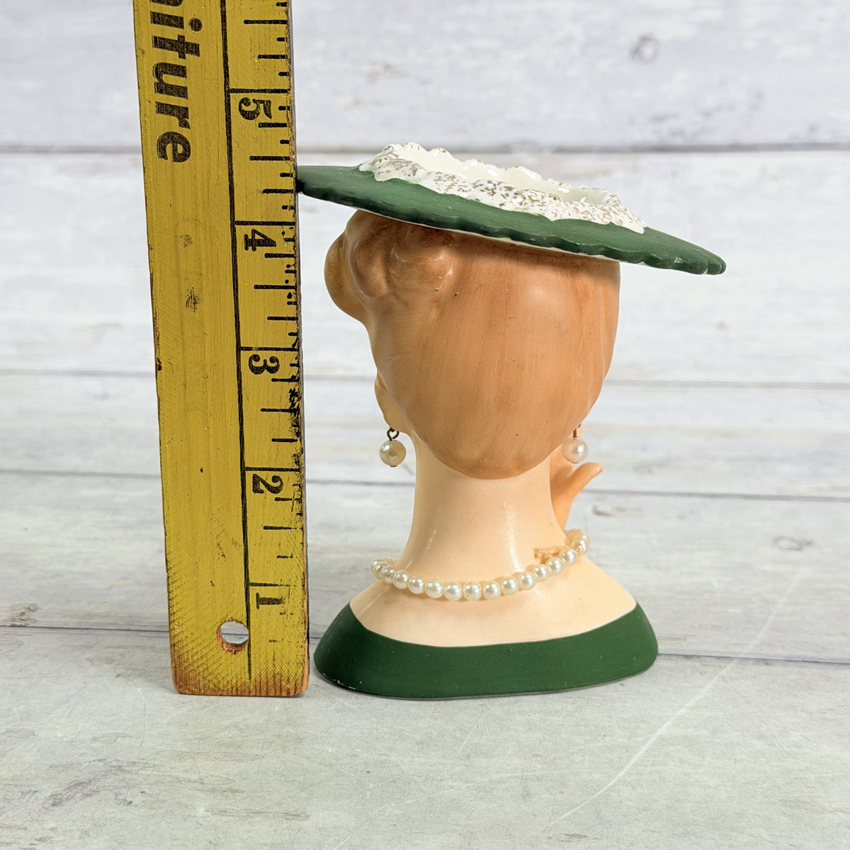 LH35 — Green hat vase beside ruler