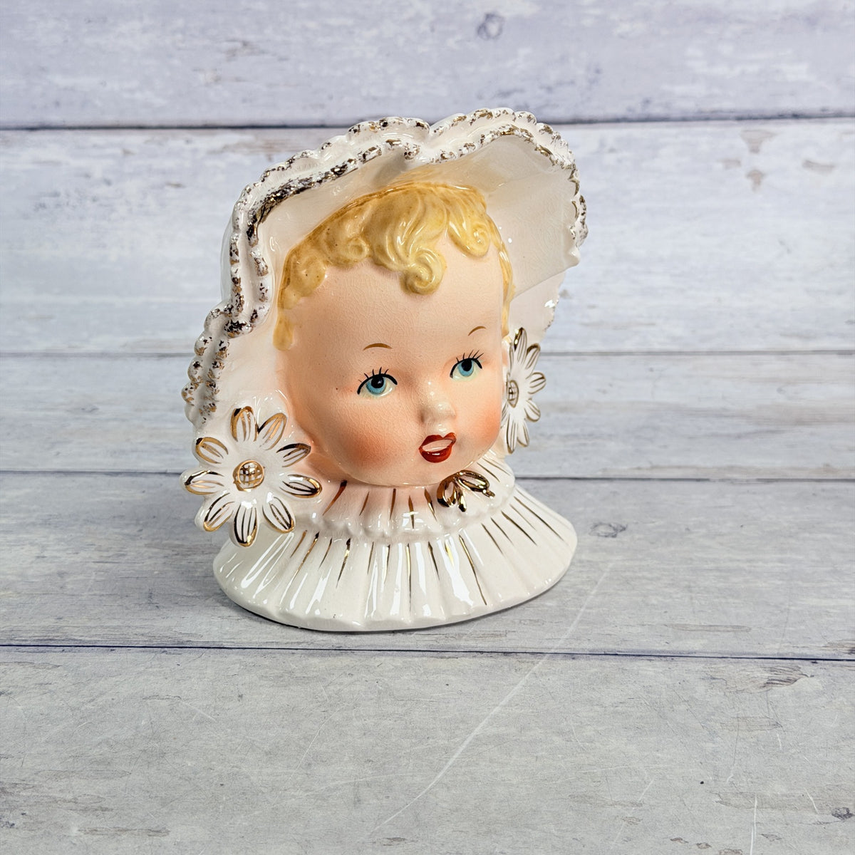 LH38 — Front of Napco child with white bonnet and flowers