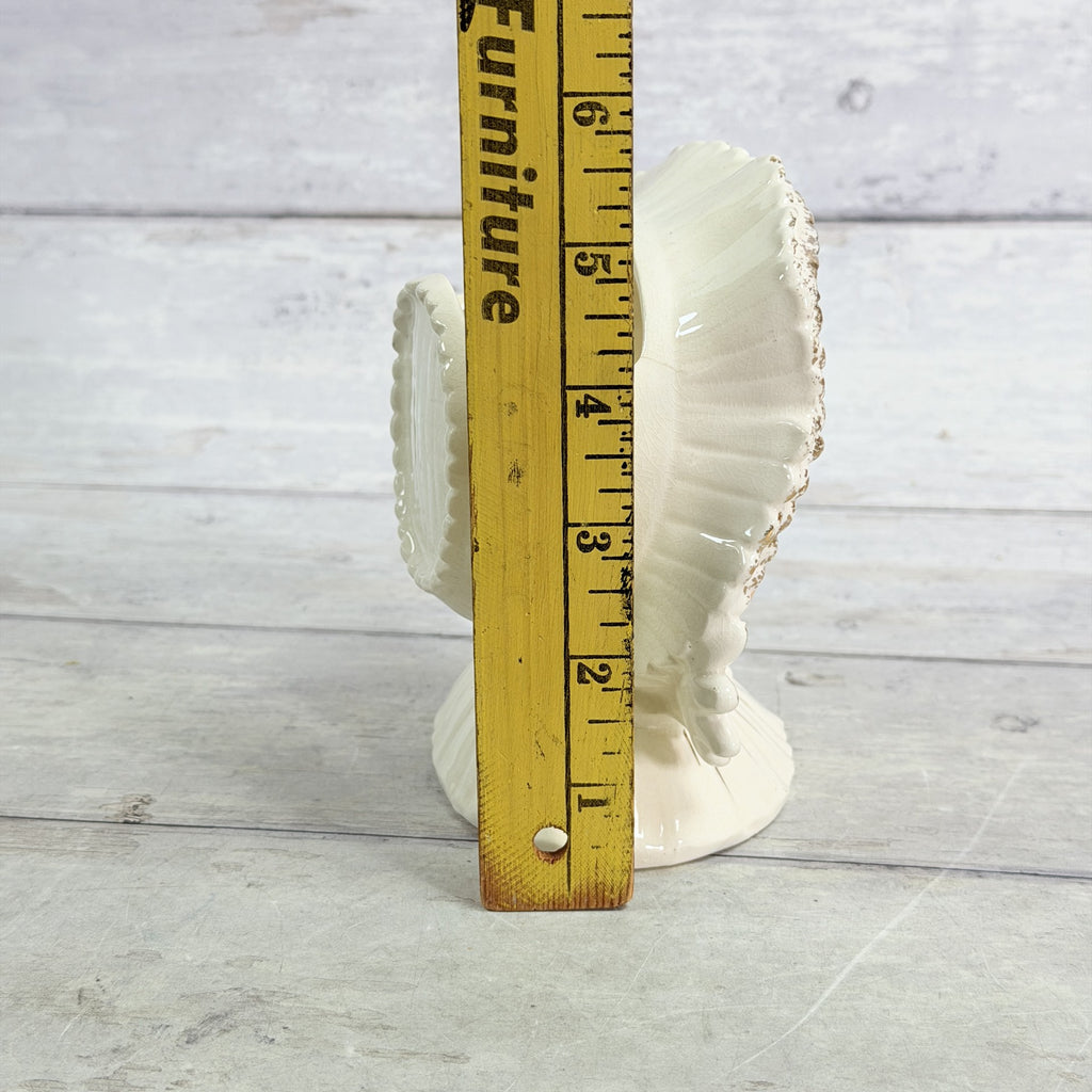 LH38 — White bonnet child beside ruler