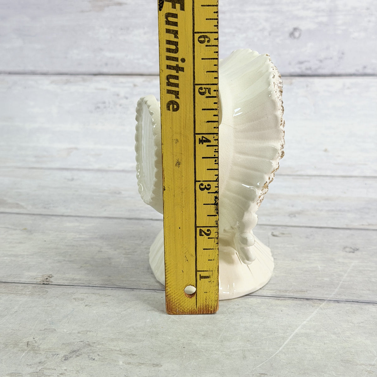 LH38 — White bonnet child beside ruler