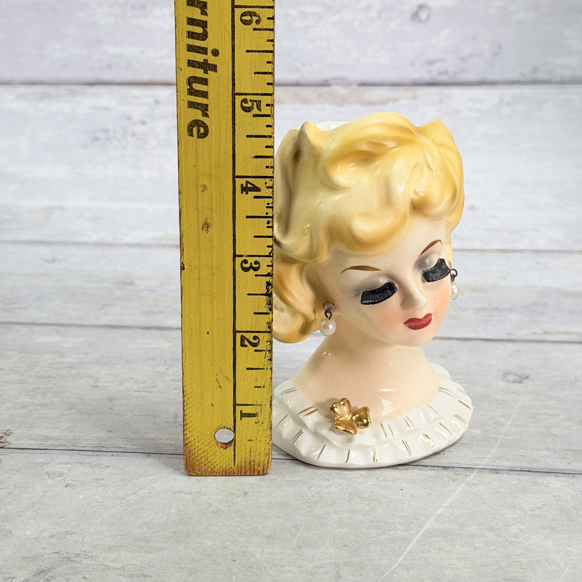 LH41 — Blonde curl vase beside ruler