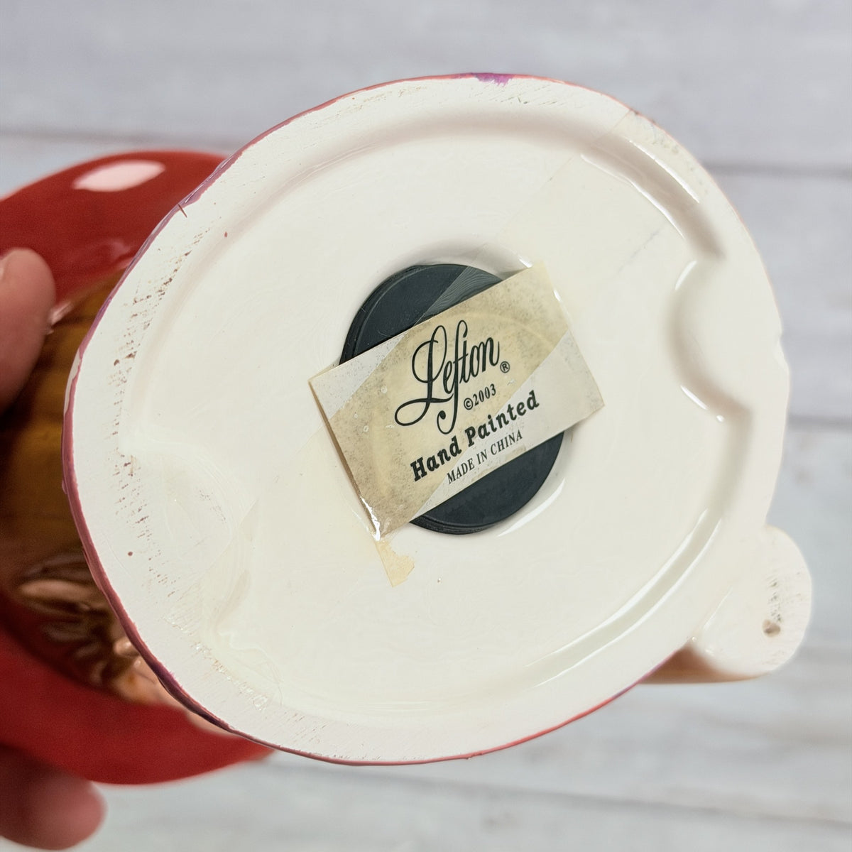 LH43 — Lefton label and black stopper beneath base
