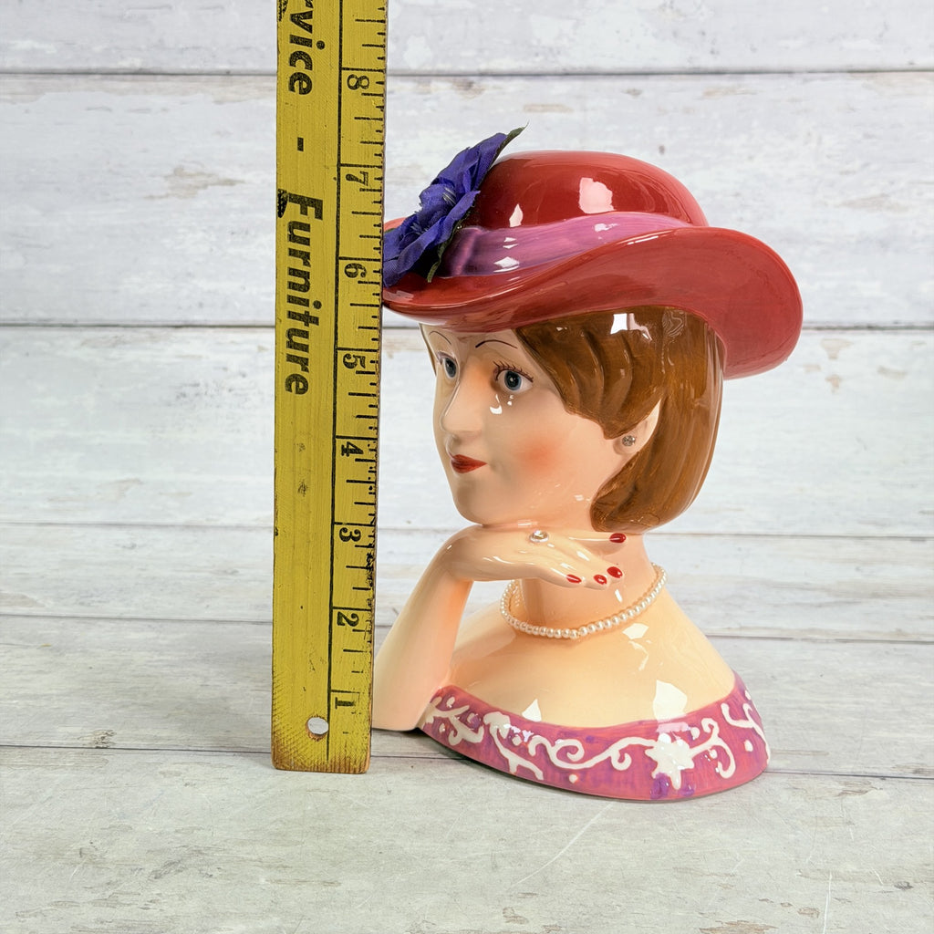LH43 — Coin bank beside ruler