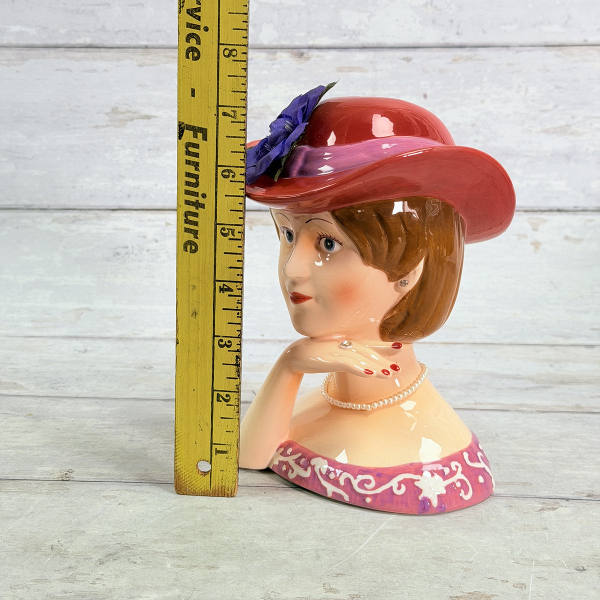 LH43 — Coin bank beside ruler