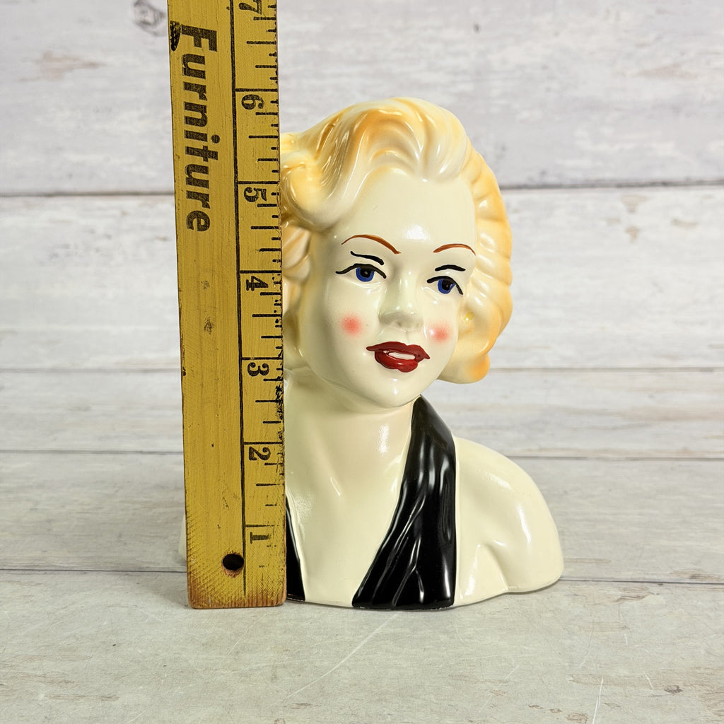 LH47 — Black scarf vase beside ruler