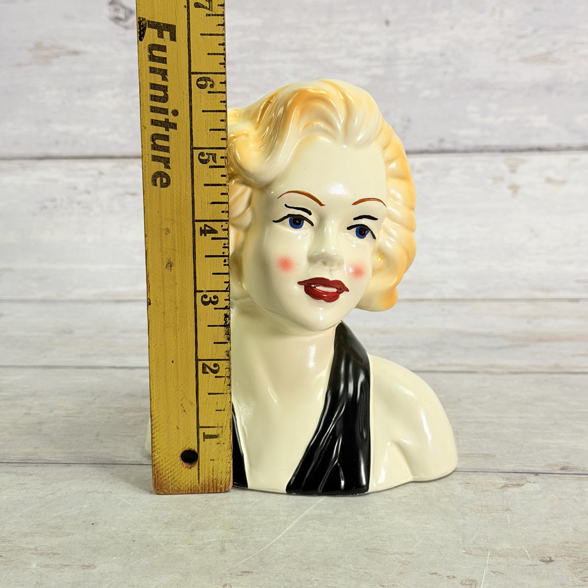 LH47 — Black scarf vase beside ruler