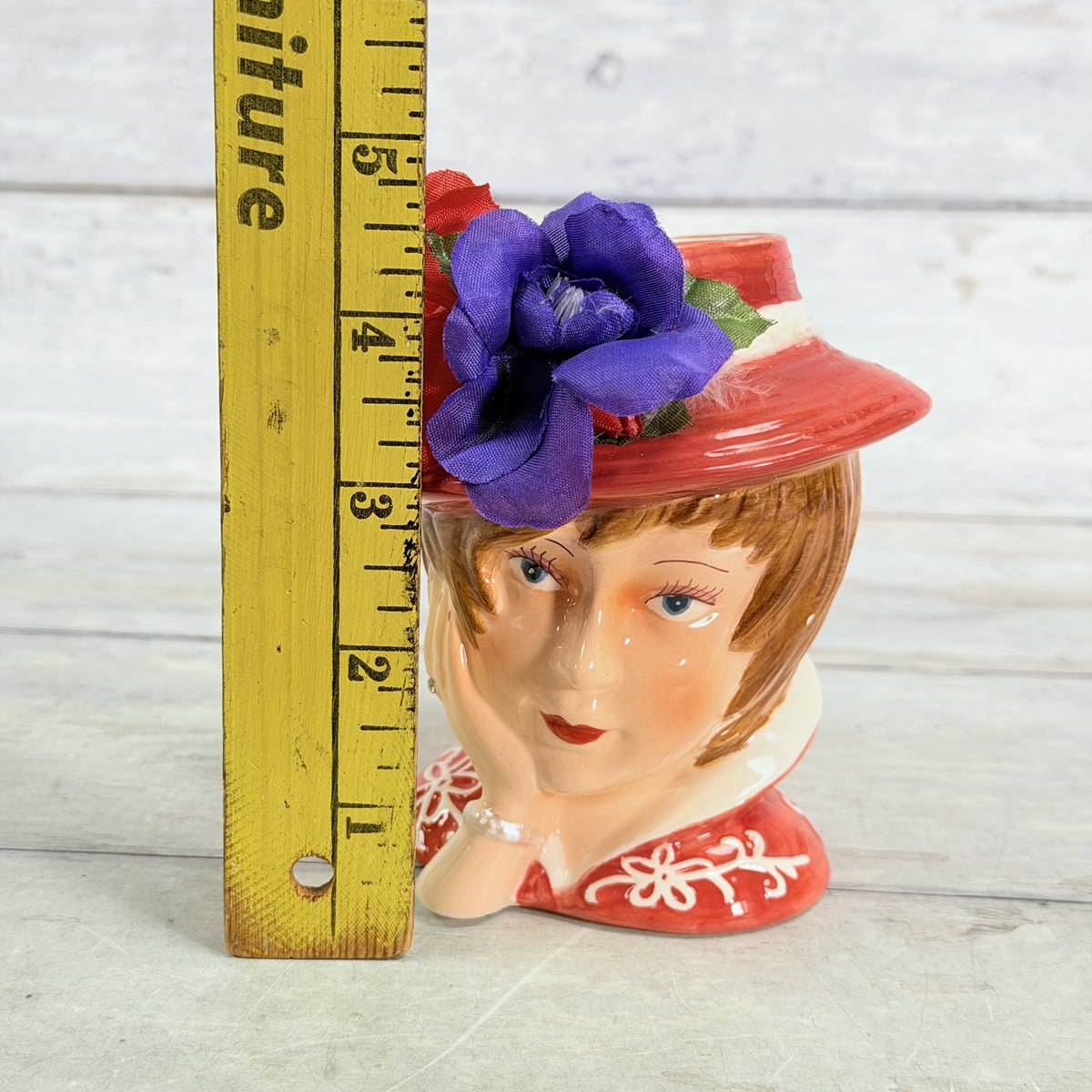 LH48 — Red hat vase beside ruler