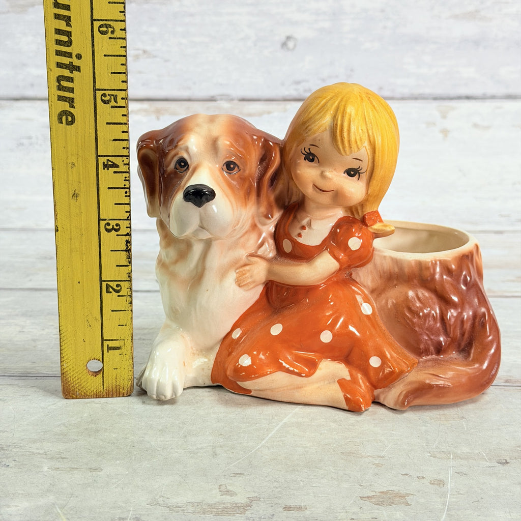LH55 — Height ruler beside girl and dog planter