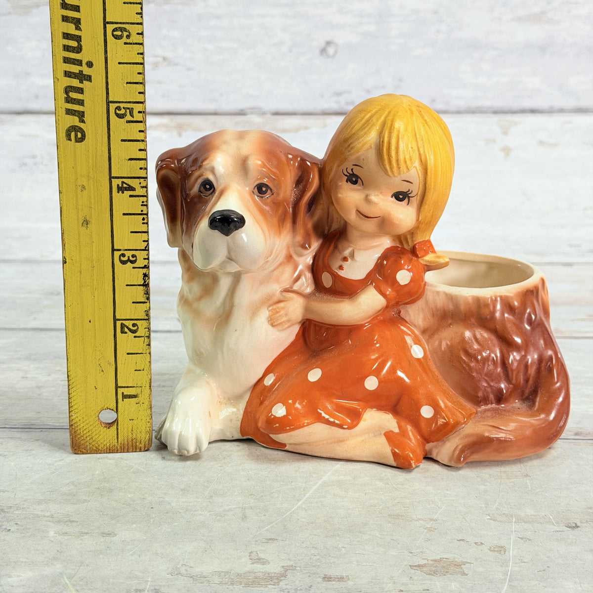 LH55 — Height ruler beside girl and dog planter