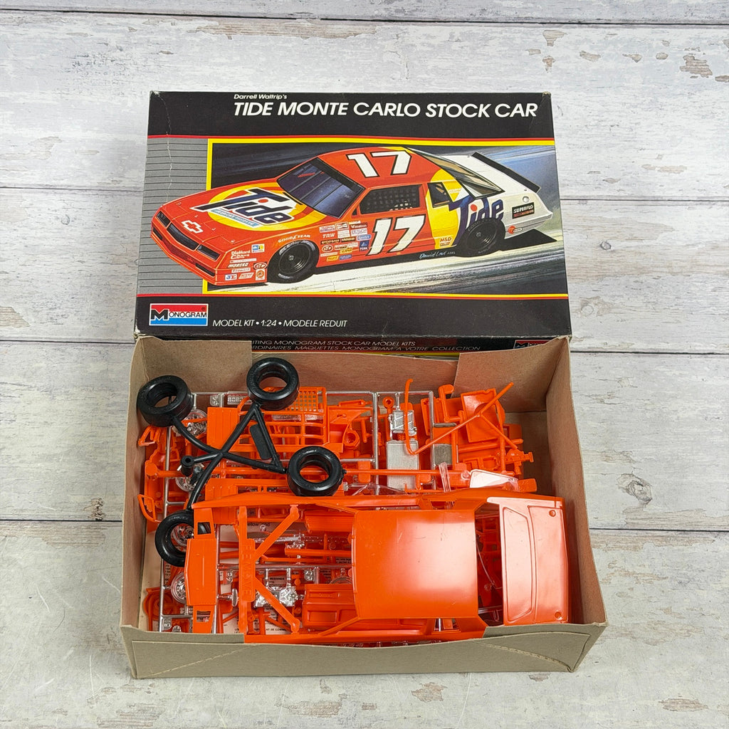 Open Monogram Tide Monte Carlo box showing unassembled parts and instructions