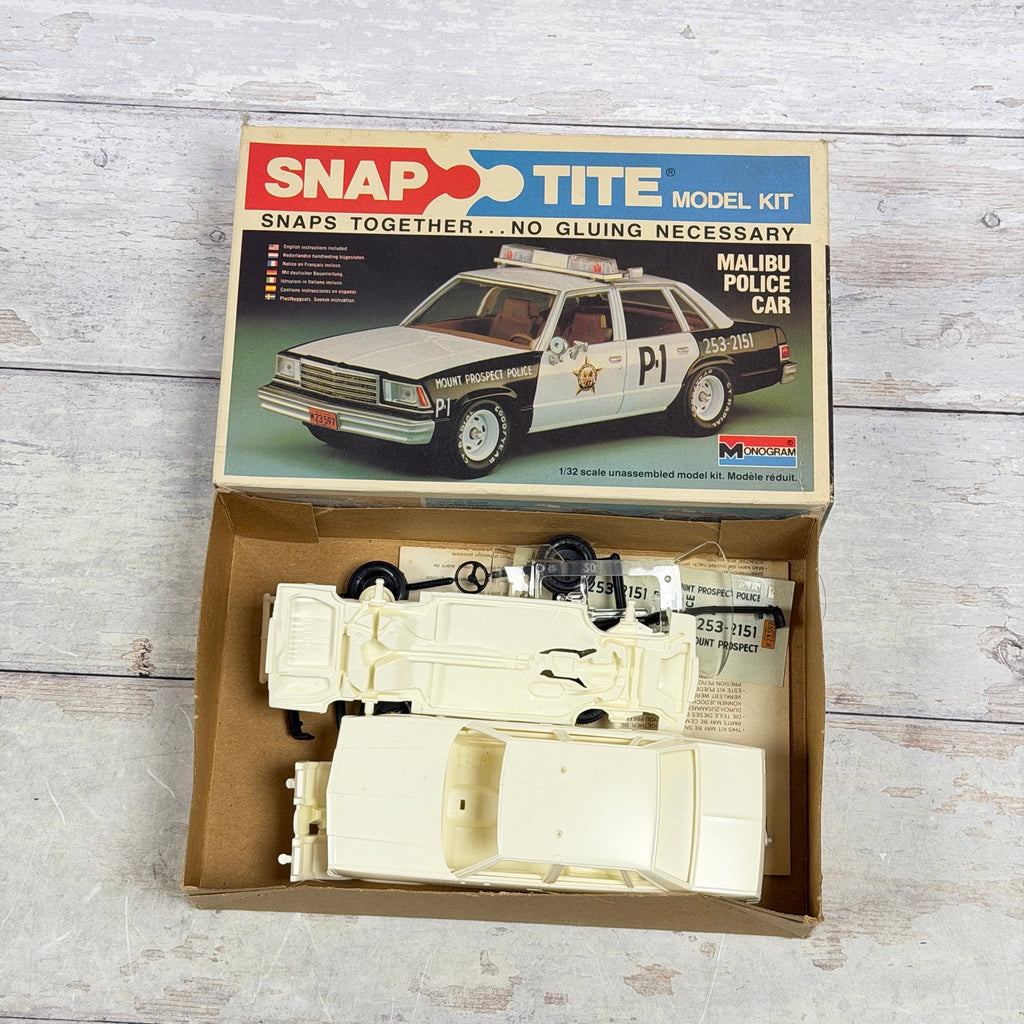 Open box showing Monogram Malibu Police Car kit contents