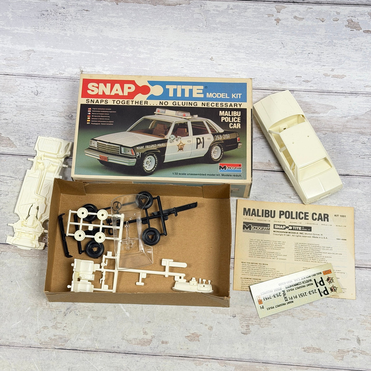 Monogram Malibu Police Car kit parts with instructions and decals