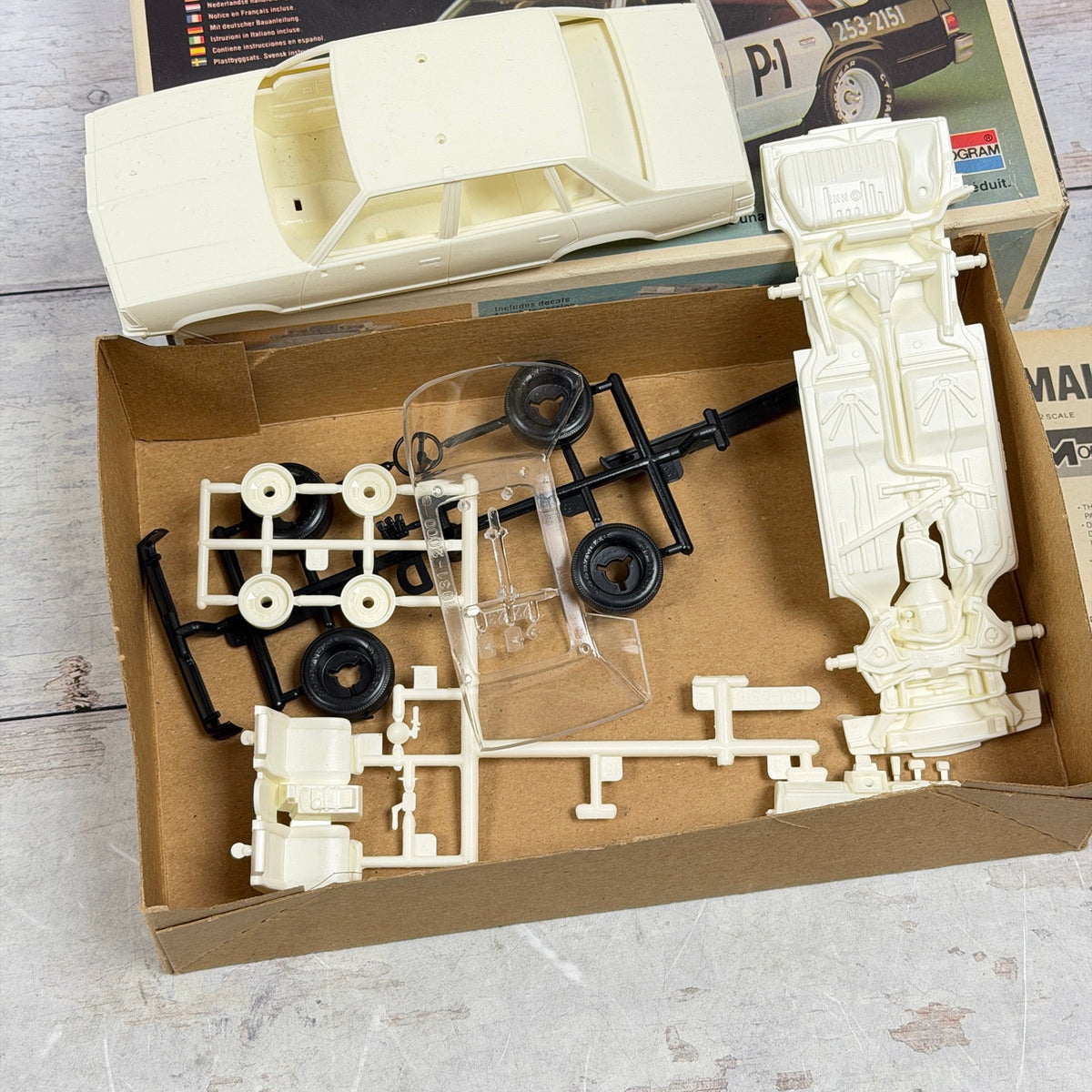 Close-up of Malibu model body chassis wheels and sprues