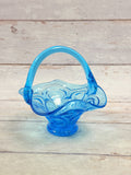 Front view of Colonial Blue Moon and Star footed glass basket with arched handle