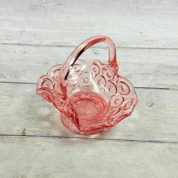 Angled view of pink Moon and Star glass basket