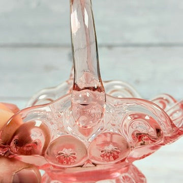 Other applied handle attachment on pink glass basket