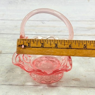 Arched handle of pink Moon and Star basket with ruler
