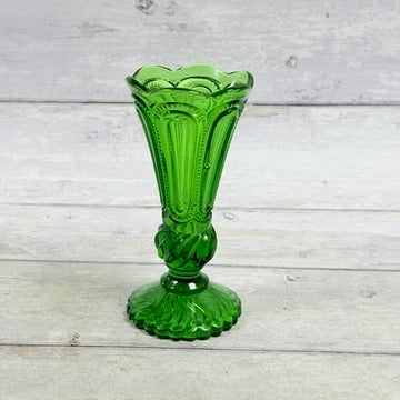 Emerald green pressed glass pedestal bud vase with scalloped rim and ornate stem