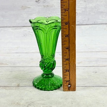 Green pedestal vase alongside ruler approximately six and three quarter inches tall