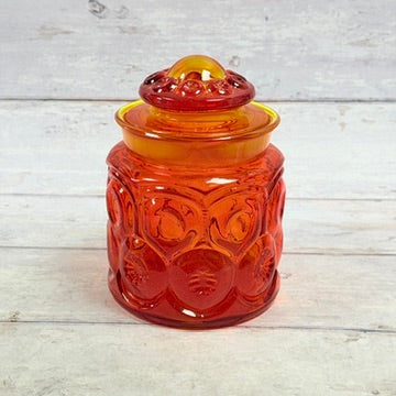 Amberina Moon and Star glass canister with domed lid front view