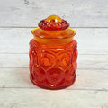 Amberina Moon and Star glass canister with domed lid front view
