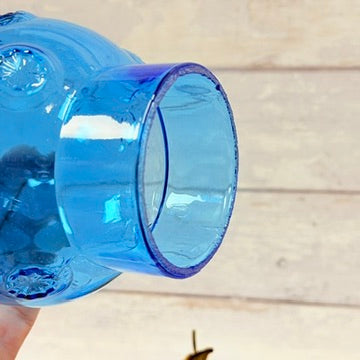 Side view of blue glass oil lamp base