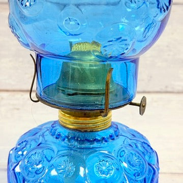 Burner assembly and wick adjustment on blue oil lamp