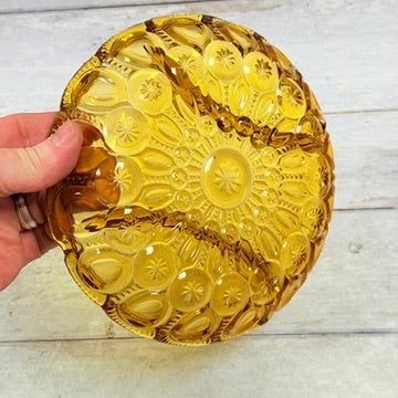 Underside of L.E. Smith amber pressed glass Moon and Star relish dish