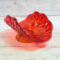 Angled view of the Moon and Star amberina glass pedestal banana bowl