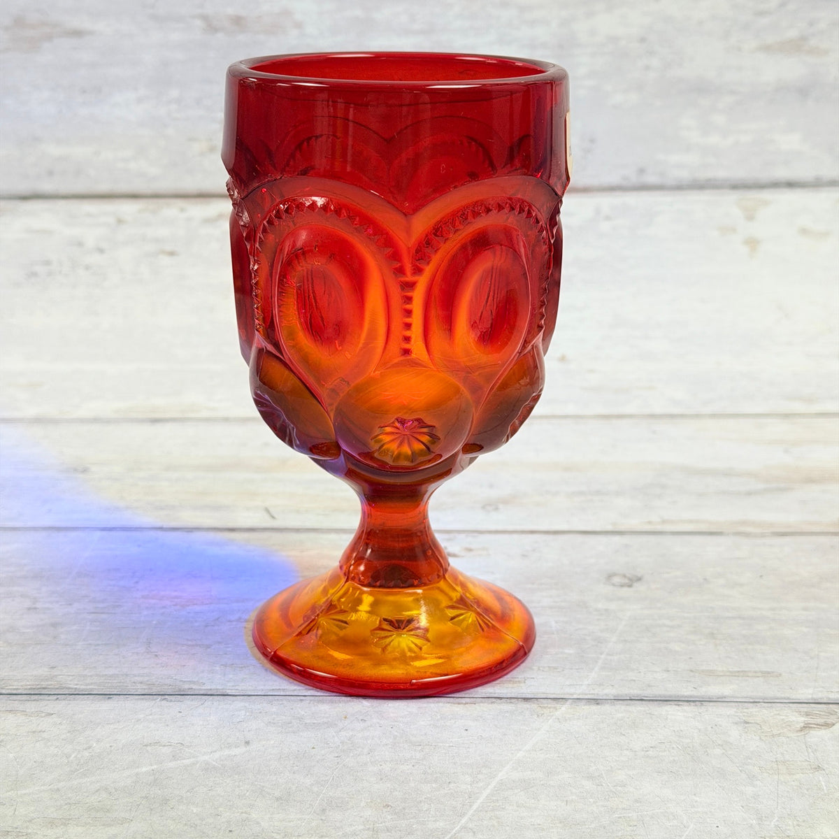 Representative Moon and Star amberina goblet under accent lighting