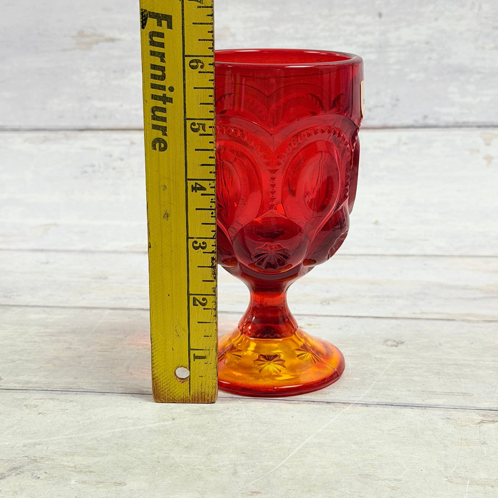 Representative amberina Moon and Star goblet beside ruler showing approximate six-inch height