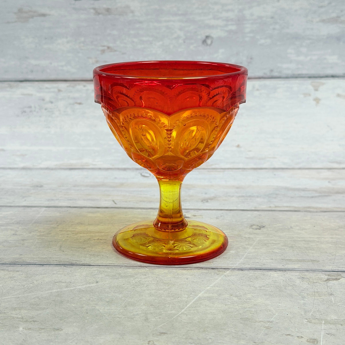Moon and Star amberina pedestal sherbet cup with red rim and golden yellow stem