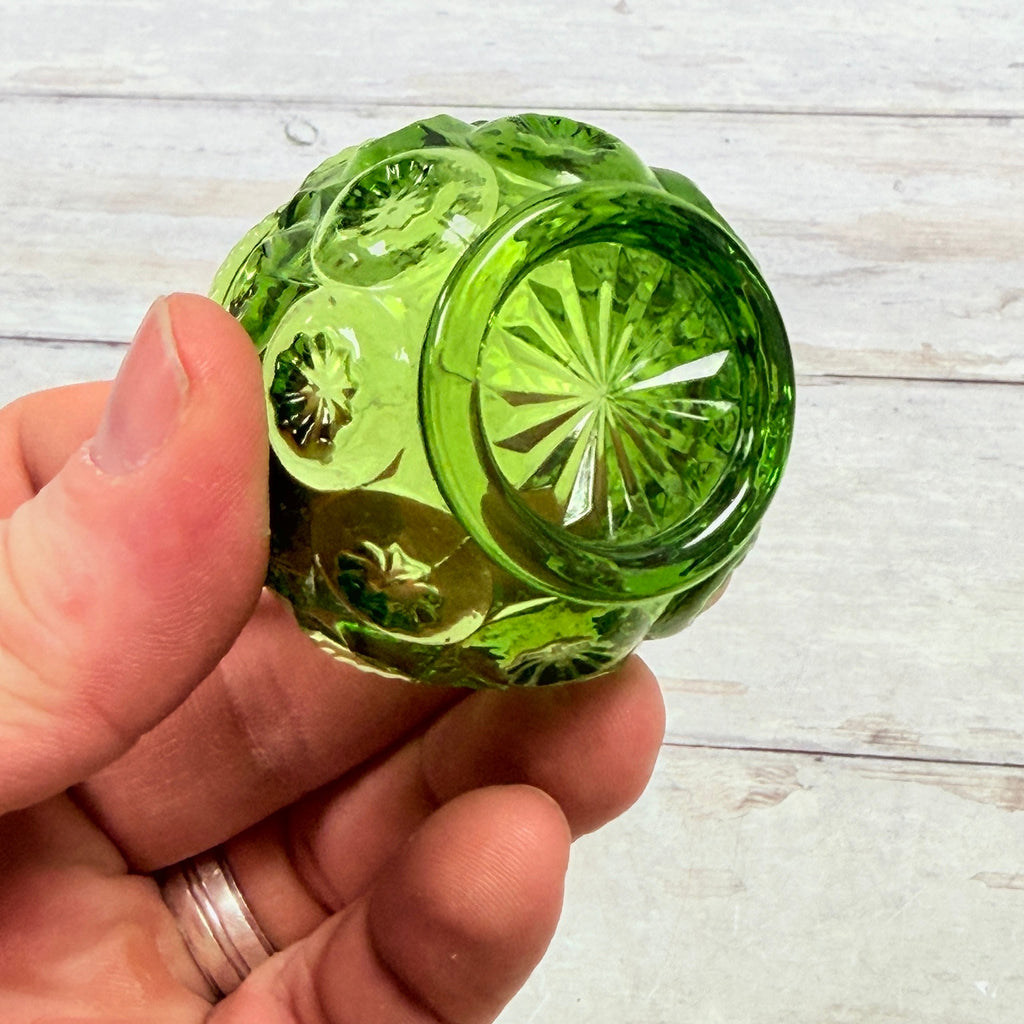 Underside of green glass Moon and Star salt dip showing ring foot and starburst