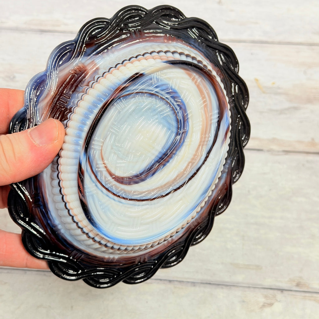 Underside of Mosser Glass amethyst and white slag hen-on-nest covered dish