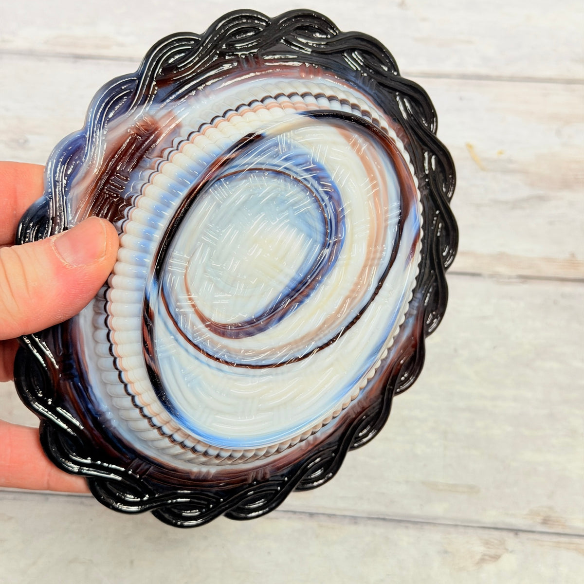 Underside of Mosser Glass amethyst and white slag hen-on-nest covered dish