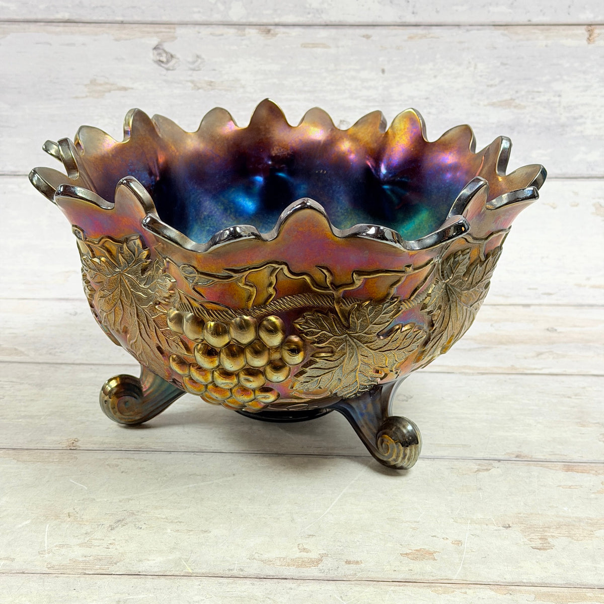 Northwood Grape and Cable carnival glass large fruit bowl with three scroll feet