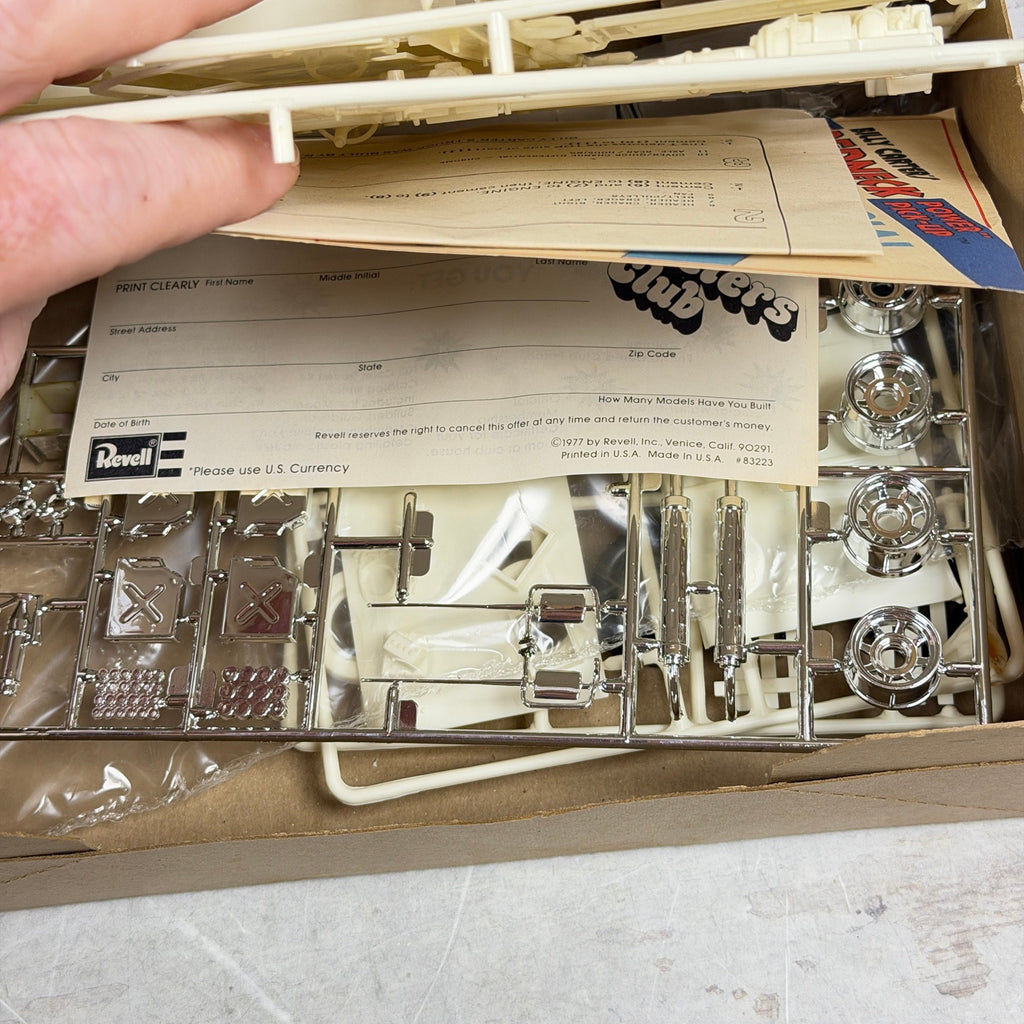 Chrome-plated parts and Revell club insert inside Billy Carter's H-1385 model kit