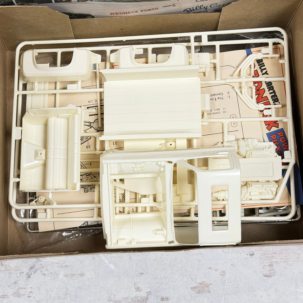 Cream plastic sprues and separate truck cab in Revell Billy Carter's pickup model kit