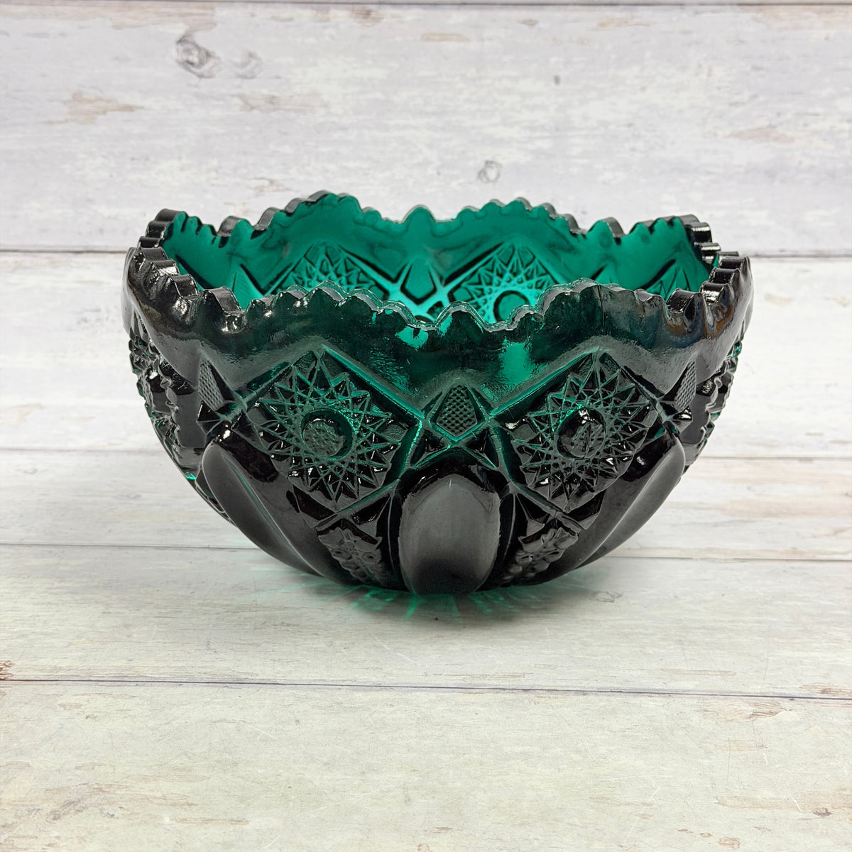 L.E. Smith Greenbriar teal glass bowl with molded starburst diamonds, oval panels and a scalloped rim