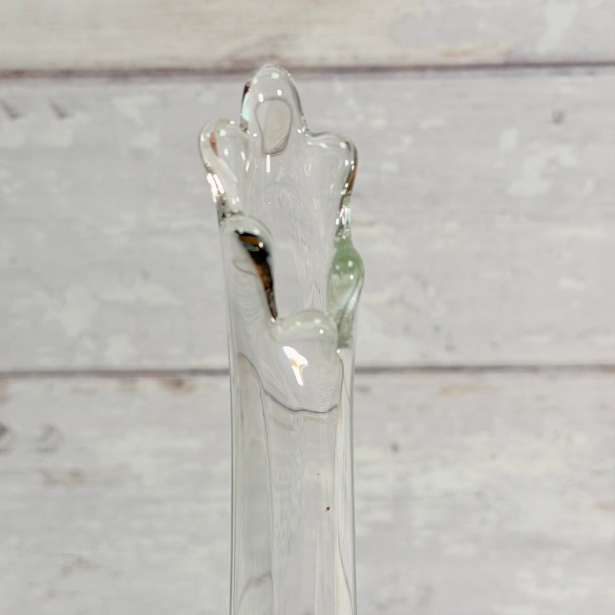 Close-up of the six-petal rim on the clear L.E. Smith swung vase