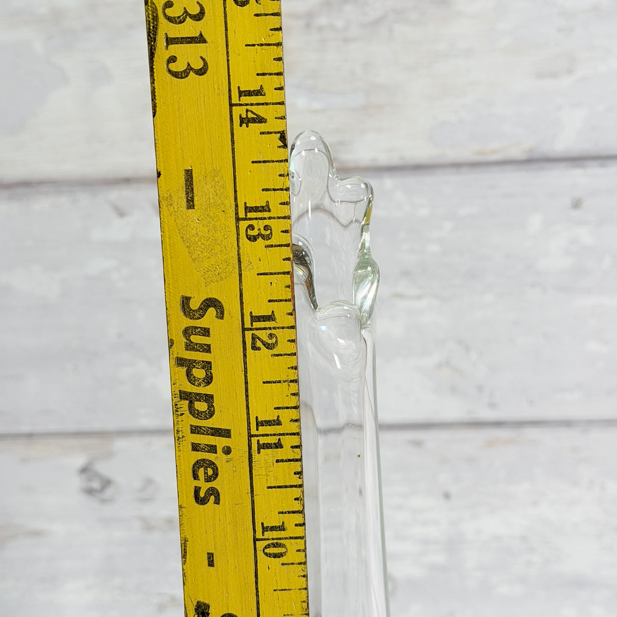 Detail of the vase rim beside a ruler
