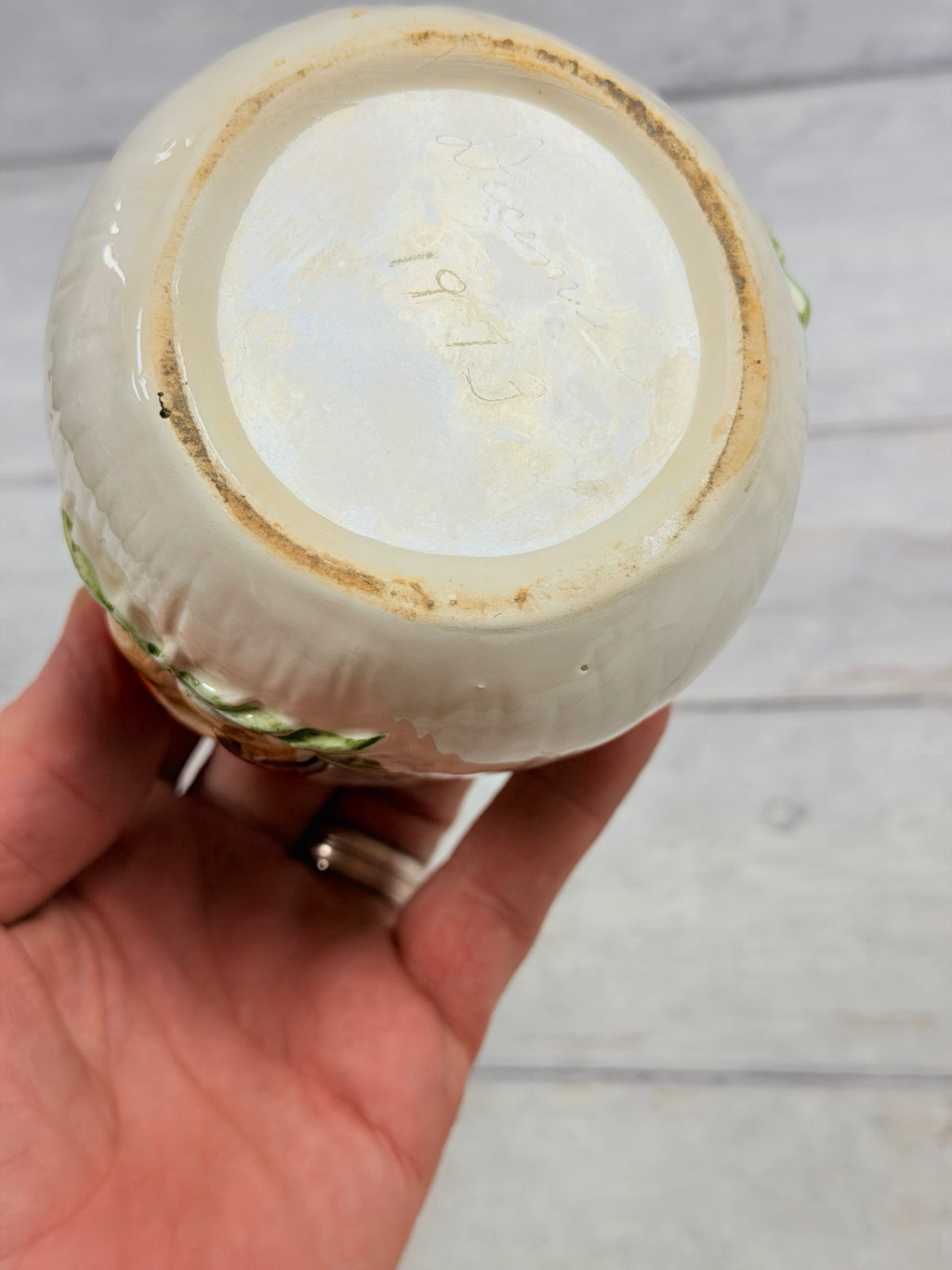 Underside with faint handwritten marking and shelf wear