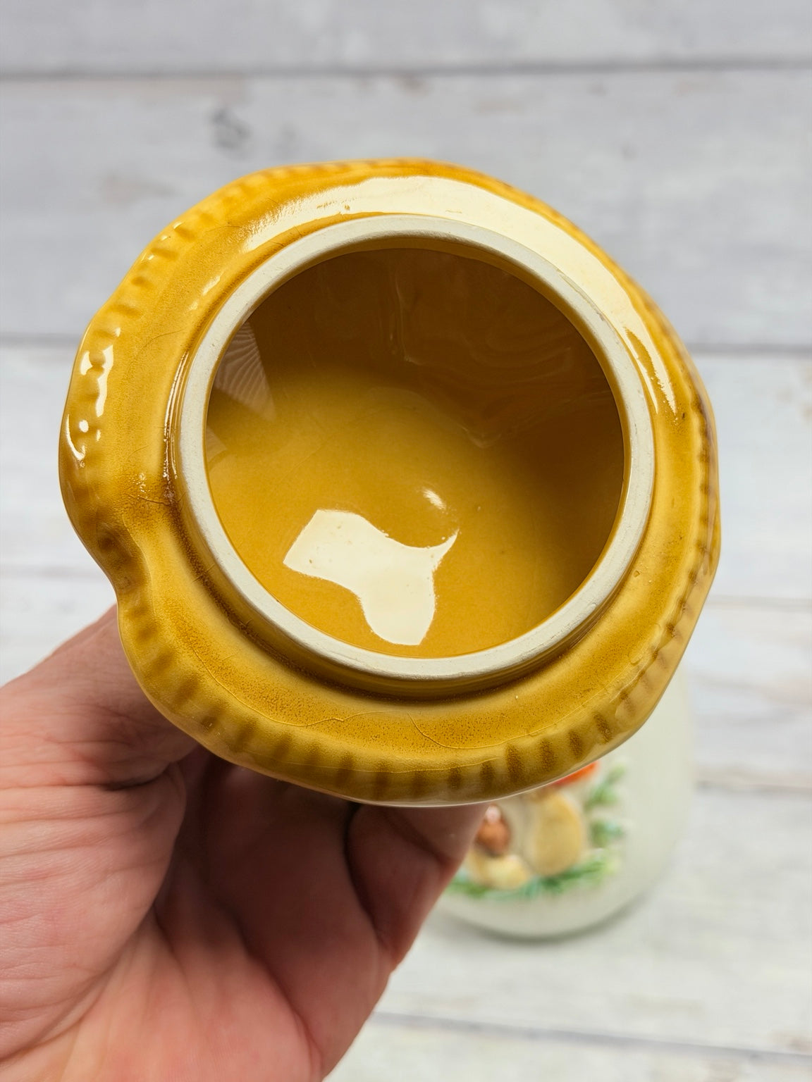 Underside of gold lid showing glaze wear and fine crazing